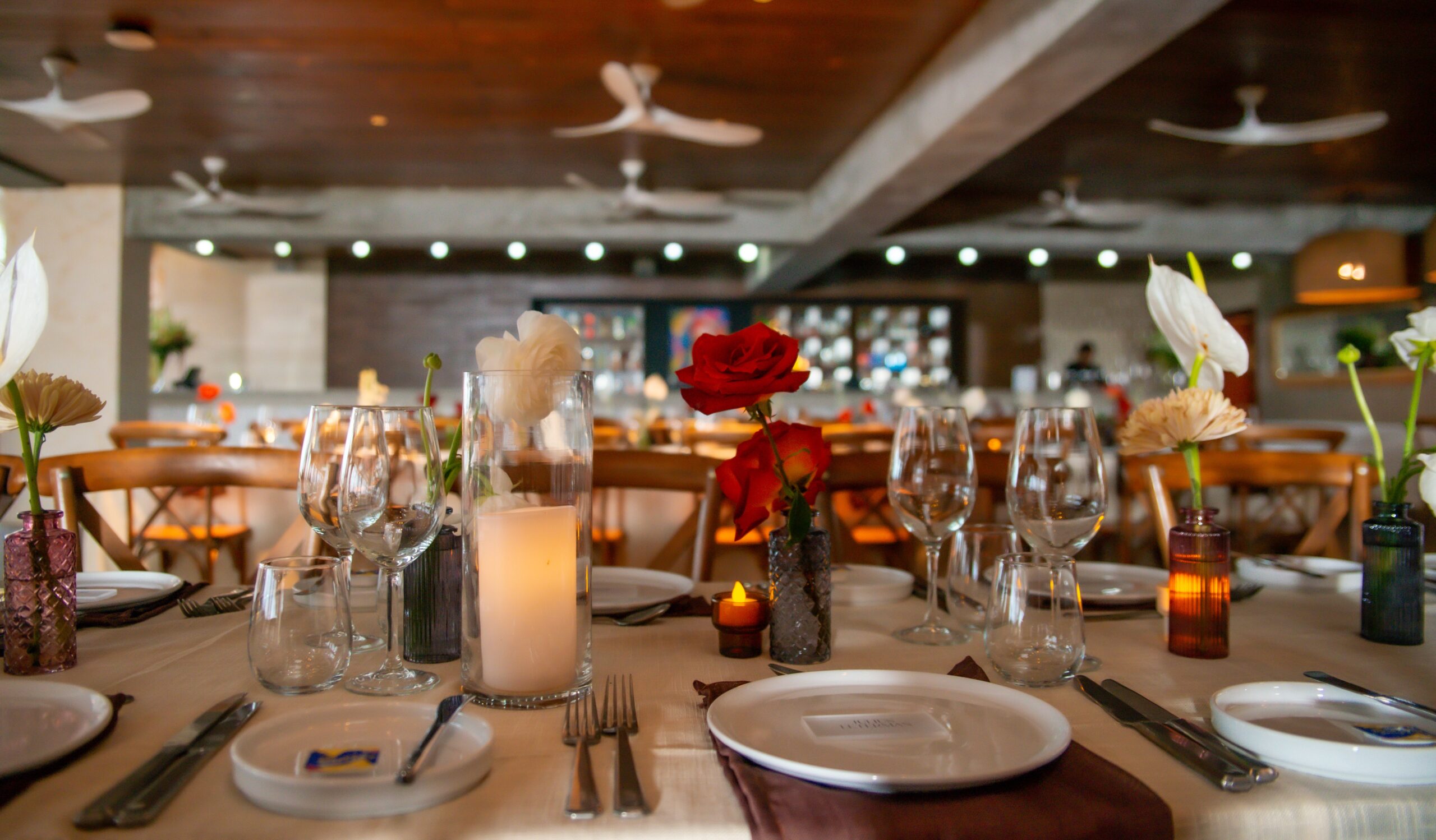 Elegant table setting with flowers at W Punta Cana, adult all-inclusive resort.