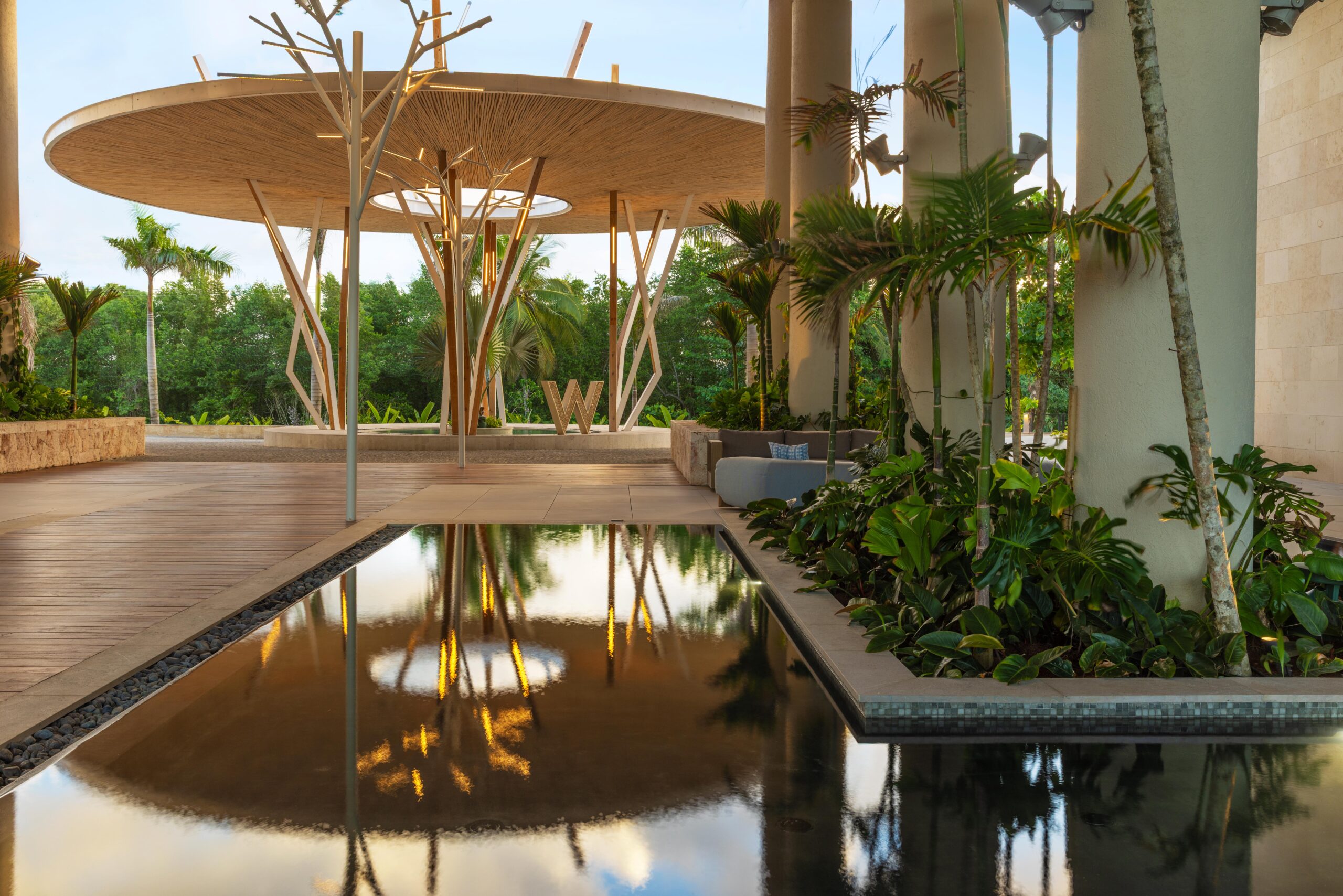 W Punta Cana entrance with water feature and tropical plants.