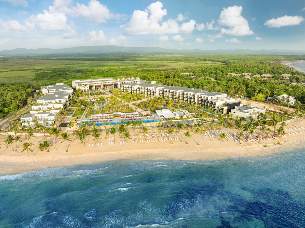 Aerial view of the W Punta Cana resort, showcasing its beachfront location and pools.