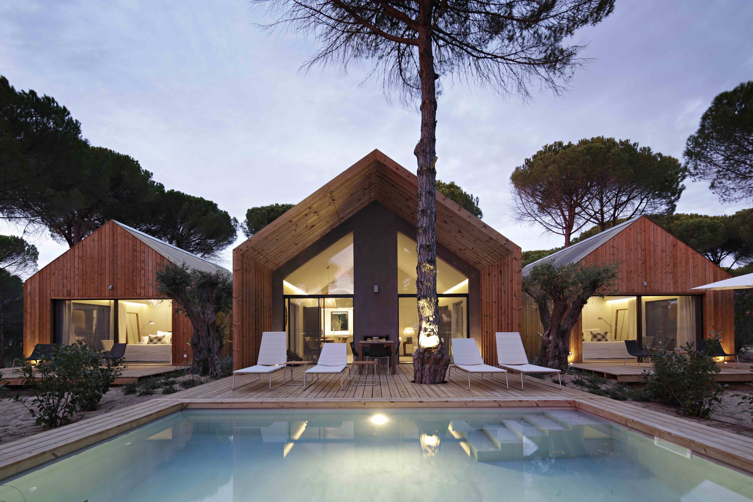 Modern wooden cabins with pool at Sublime Comporta resort