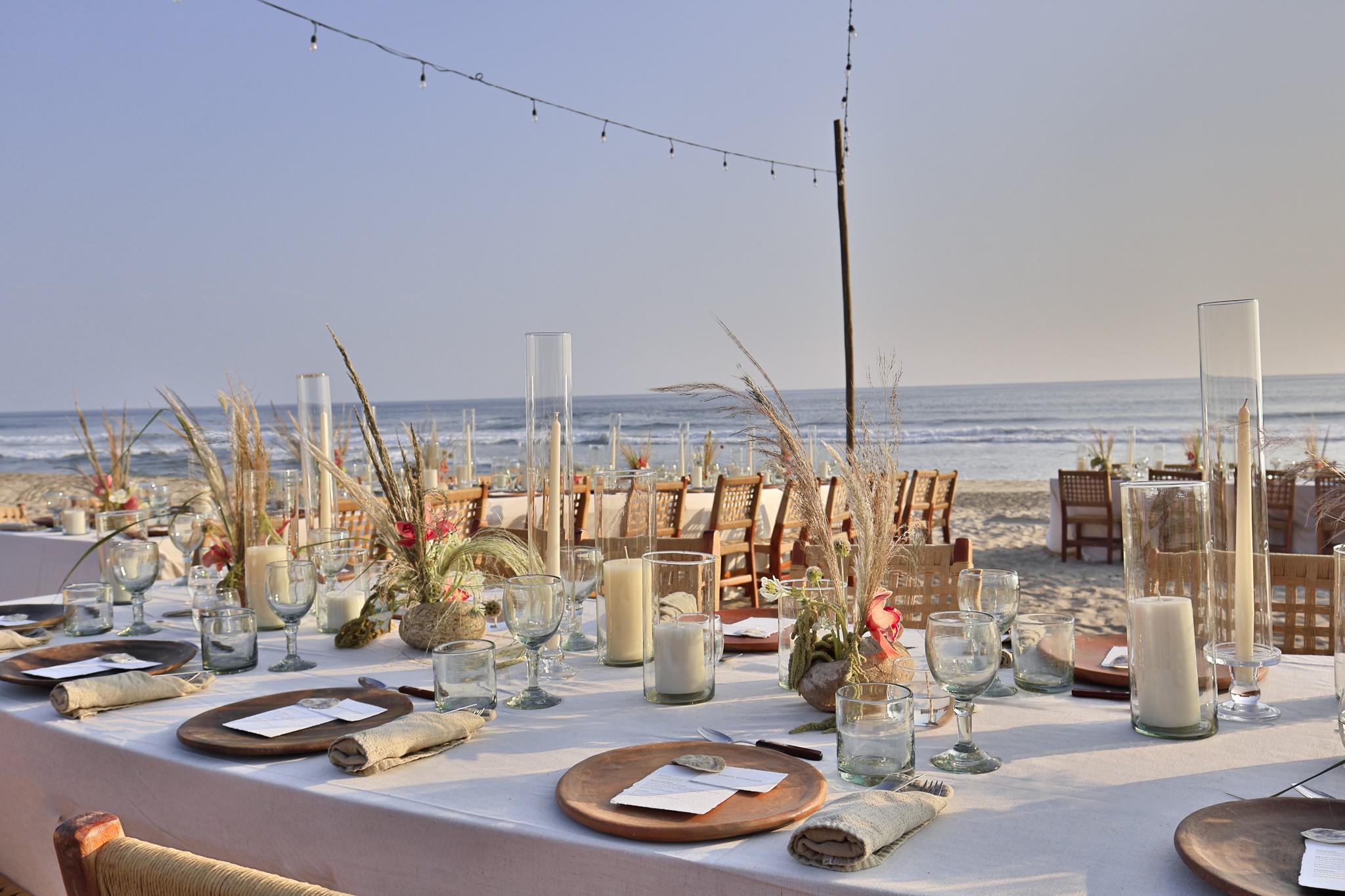 Elegant beachside wedding reception tables set for dinner at Hotel Casa Yuma