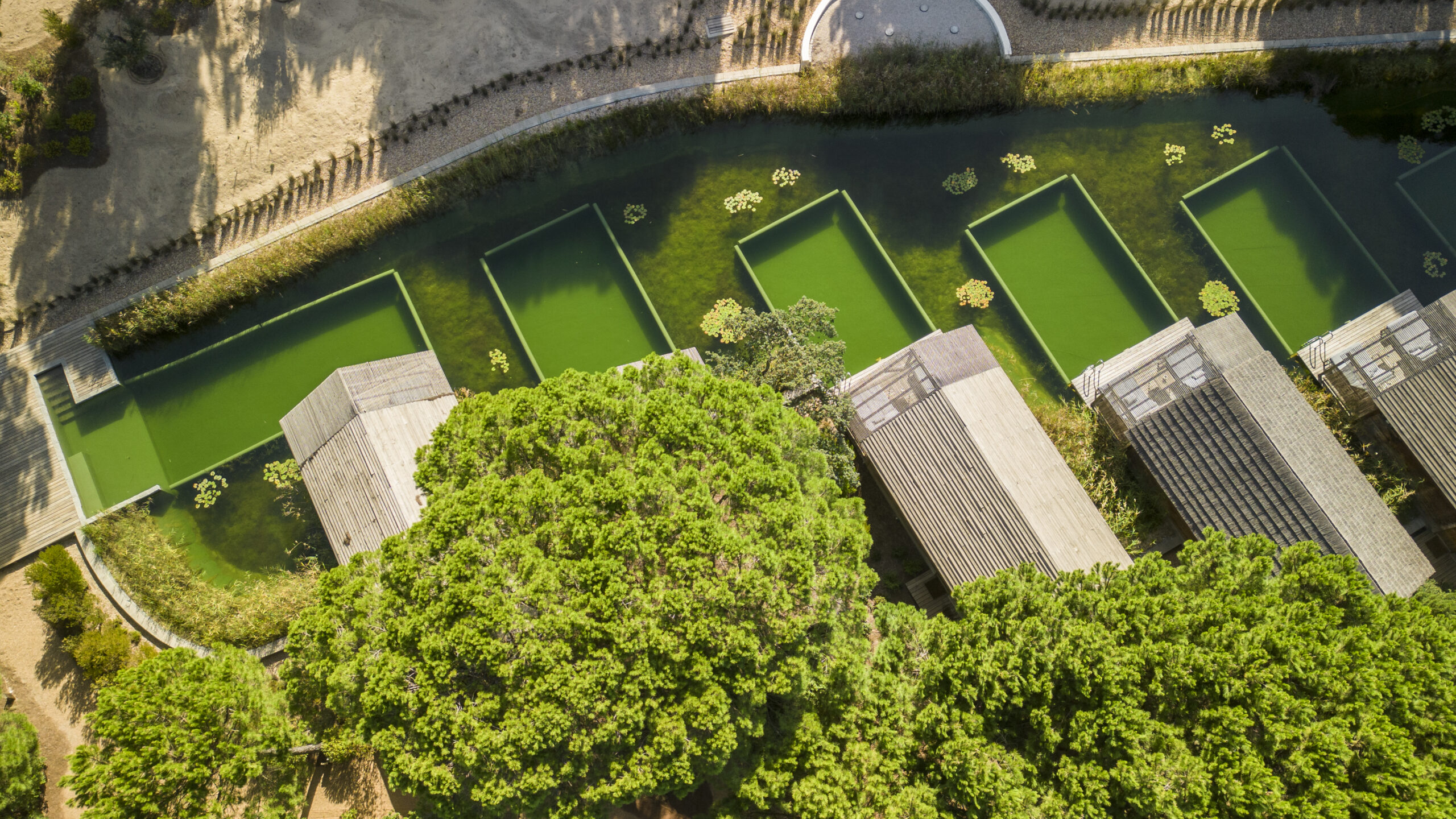 Aerial view of Sublime Comporta resort with pools and lush greenery